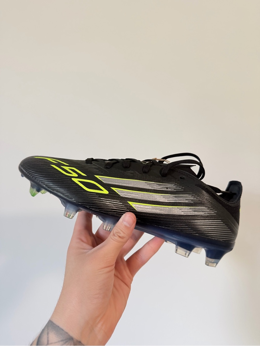 Adidas Men's Black Soccer Cleats with Neon Yellow Accents